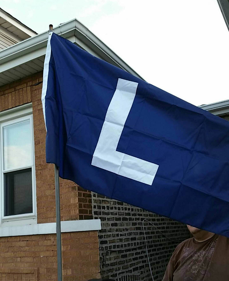 Blue L Flag flying at home